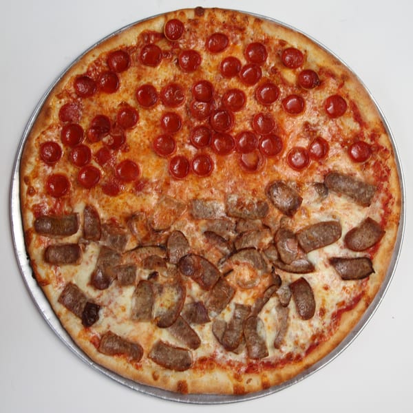 Fort Lee Pizzeria's large pizza, half pepperoni and half sausage, on a metal tray.