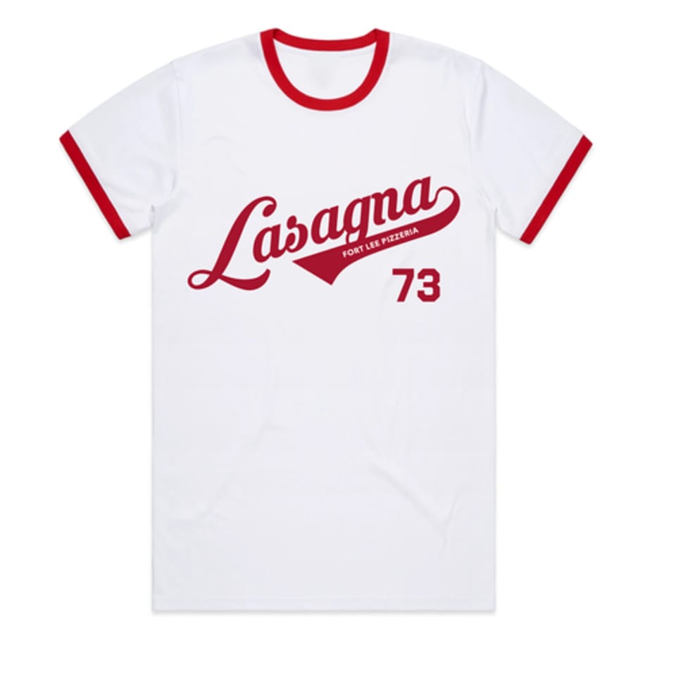 White t-shirt with red trim, featuring "Lasagna Fort Lee Pizzeria 73" in red script.